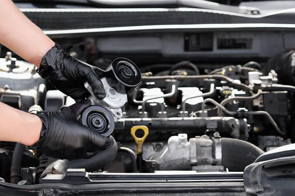 Car engine maintenance with pulley replacement