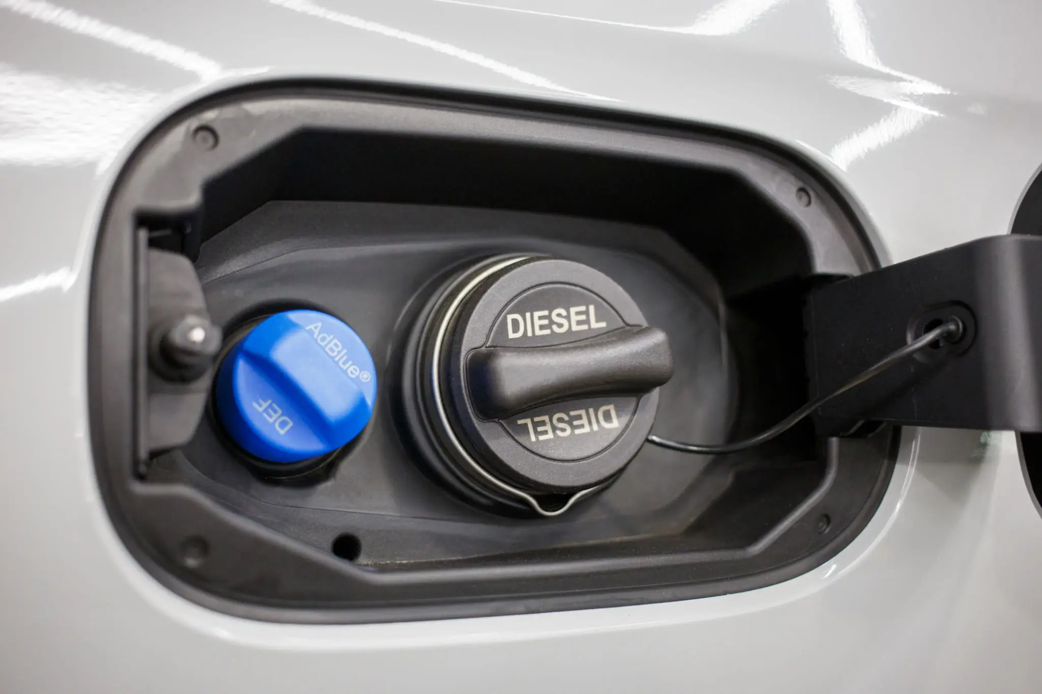 Close-up of a diesel fuel cap on a vehicle.